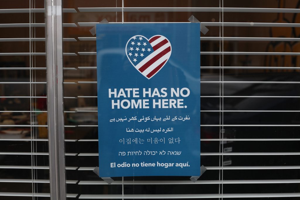 Sign Hanging In Business Denouncing Hate