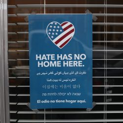 Sign Hanging In Business Denouncing Hate