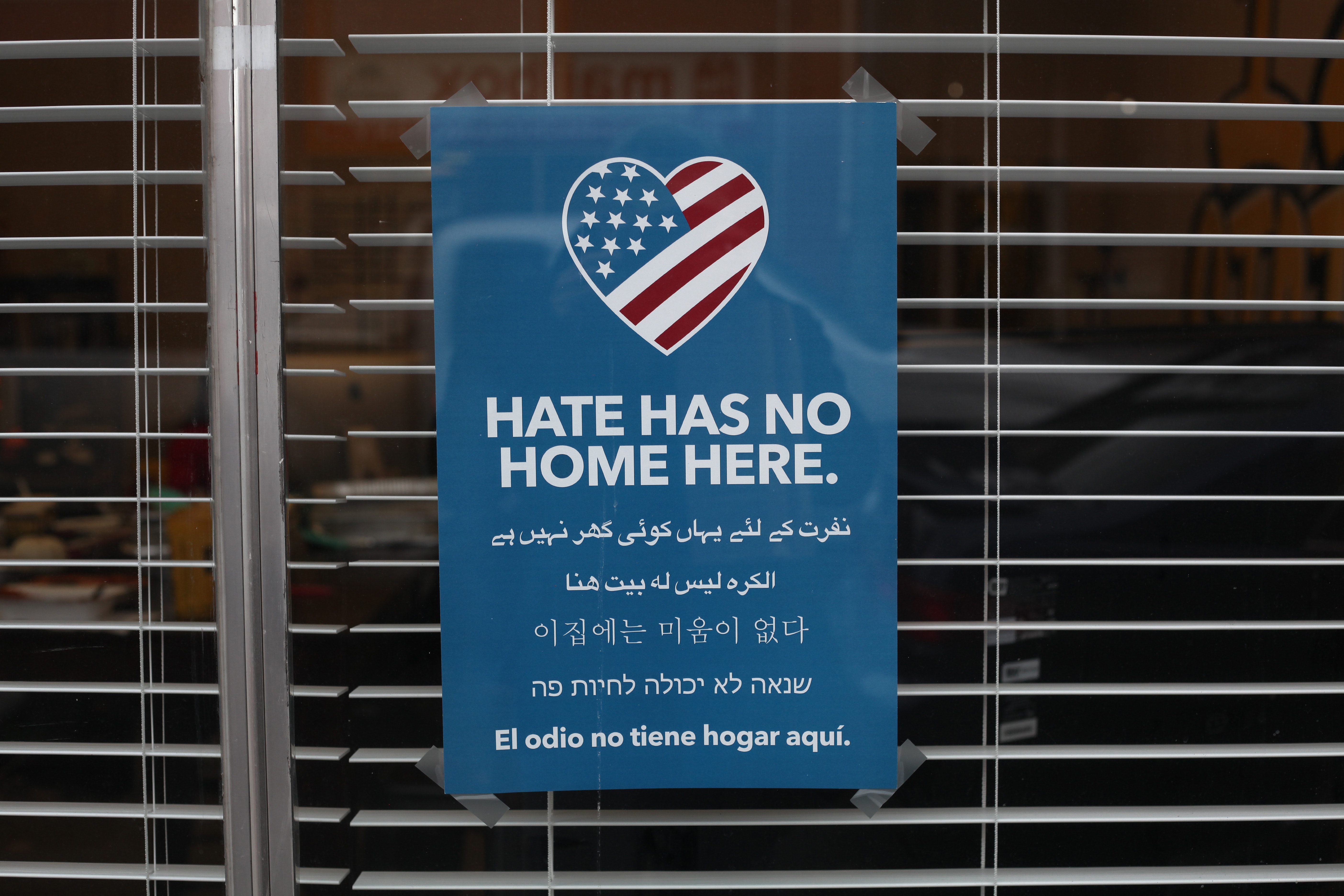 Sign Hanging In Business Denouncing Hate