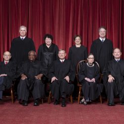 The Roberts Court, November 30, 2018.  Seated, from left to right: Justices  Stephen G. Breyer and Clarence Thomas, Chief Justice John G. Roberts, Jr., and Justices Ruth Bader Ginsburg and  Samuel A. Alito.  Standing, from left to right: Justices Neil M. Gorsuch, Sonia Sotomayor, Elena Kagan, and Brett M. Kavanaugh.  Photograph by Fred Schilling, Supreme Court Curator's Office.