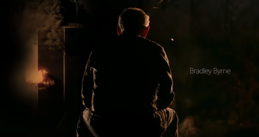 Bradley Byrne with burning trade center towers in background