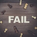 fail concept on wooden background