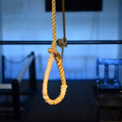 A noose hanging freely in a room
