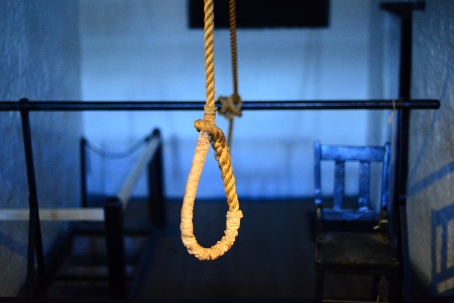 A noose hanging freely in a room